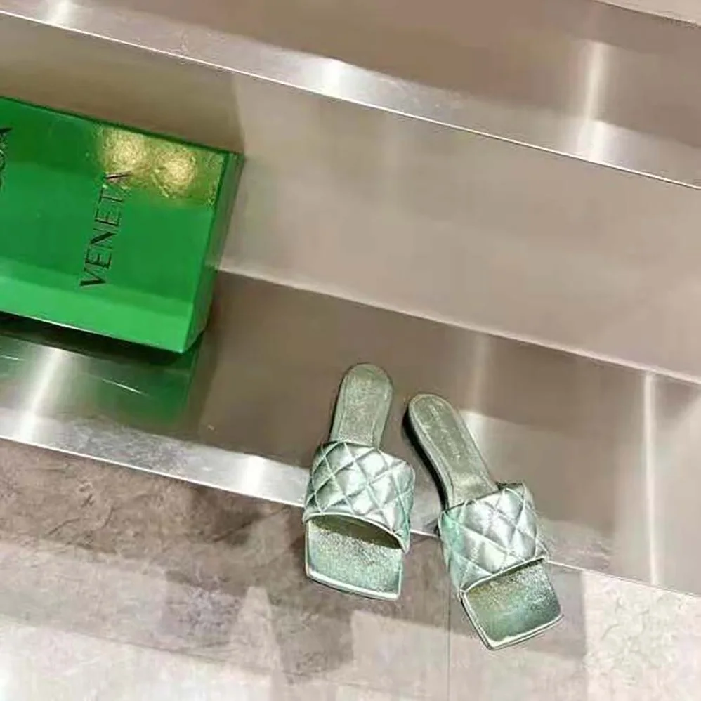 Bottega Veneta Lido Flat Sandal Intreccio Metallised Leather Flat Sandals for Women in Aqua