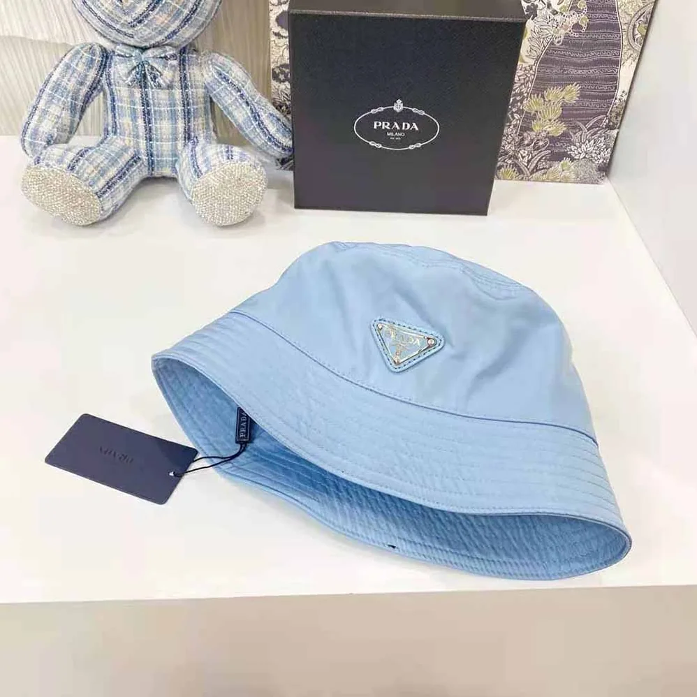 Prada Nylon Bucket Hat Decorated with the Triangle Logo for Women in Blue Prada Nylon Bucket Hat Decorated with the Triangle Logo for Women in Blue