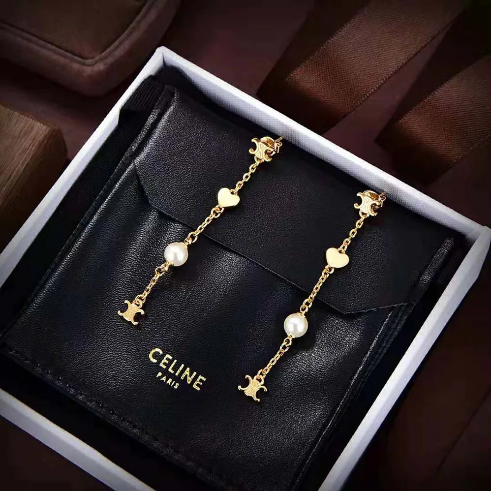 Celine Cœur Celine Charms Earrings in Brass with Gold Finish and Resin Pearl for Women Celine Cœur Celine Charms Earrings in Brass with Gold Finish and Resin Pearl for Women