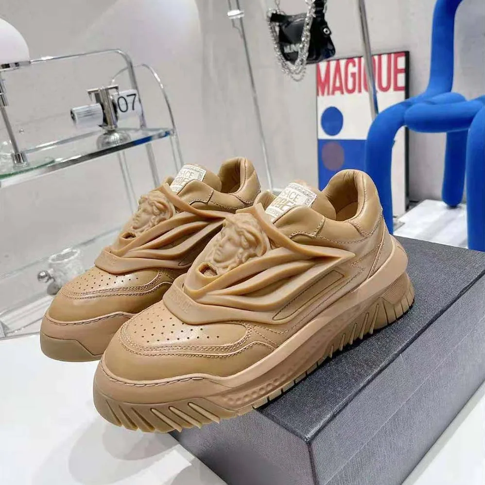 Versace Odissea Sneakers are Set on Rubber Soles with Perforated Toe Caps for Unisex in Brown Versace Odissea Sneakers are Set on Rubber Soles with Perforated Toe Caps for Unisex in Brown