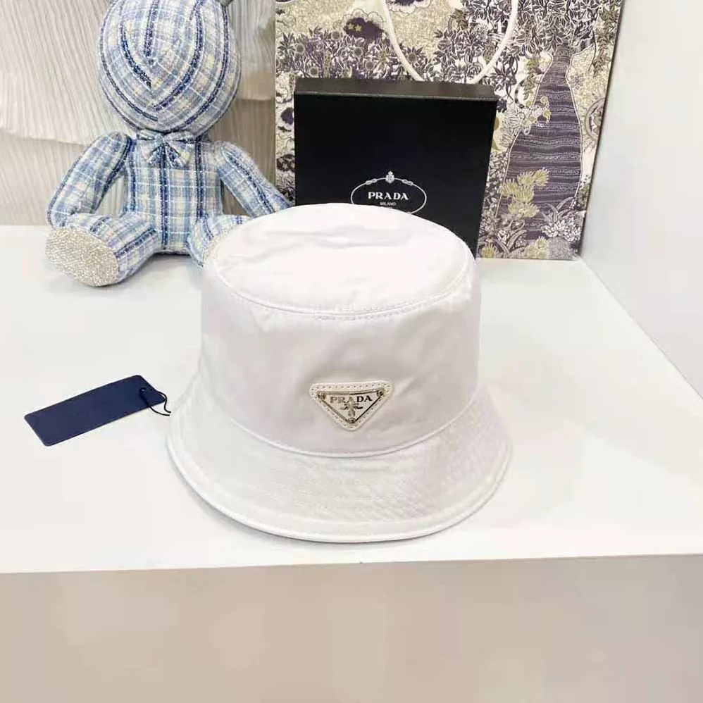 Prada Nylon Bucket Hat Decorated with the Triangle Logo for Women in White Prada Nylon Bucket Hat Decorated with the Triangle Logo for Women in White