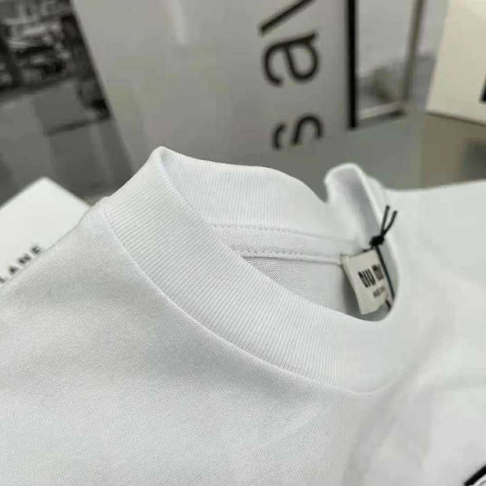 Miu Miu Embroidered Cotton T-shirt with Embroidered Logo for Women in White Miu Miu Embroidered Cotton T-shirt with Embroidered Logo for Women in White
