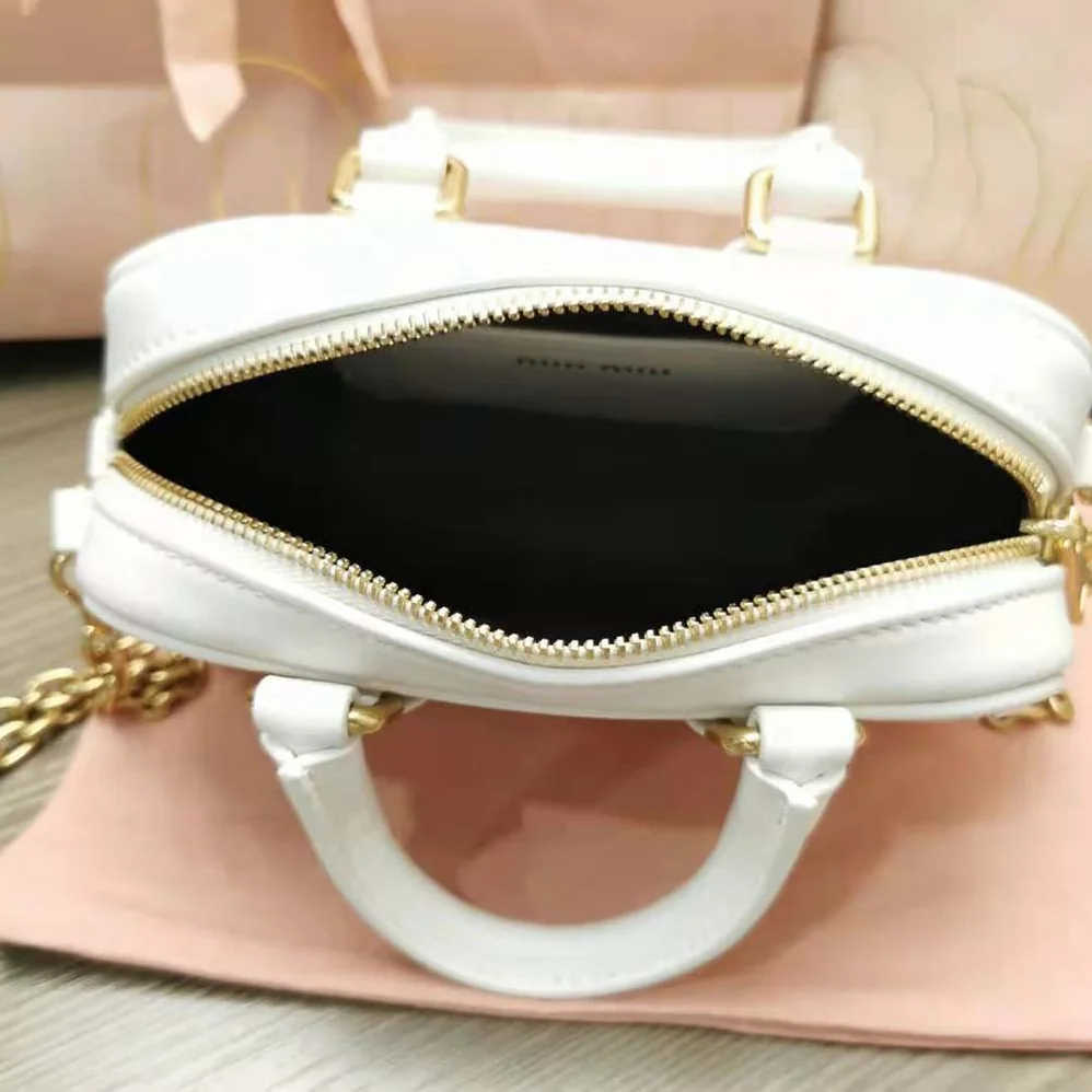 Miu Miu Matelassé Nappa Leather Top-Handle Mini-Bag for Women in White Miu Miu Matelassé Nappa Leather Top-Handle Mini-Bag for Women in White