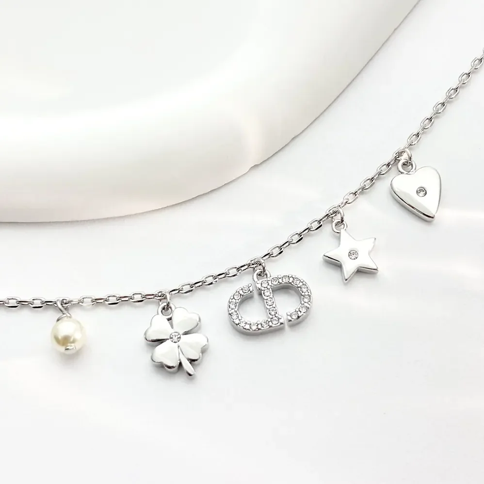 Dior Petit CD Lucky Charms Bracelet Silver-Finish Metal with White Resin Pearl and Silver for Women in Tone Crystals Dior Petit CD Lucky Charms Bracelet Silver-Finish Metal with White Resin Pearl and Silver for Women in Tone Crystals