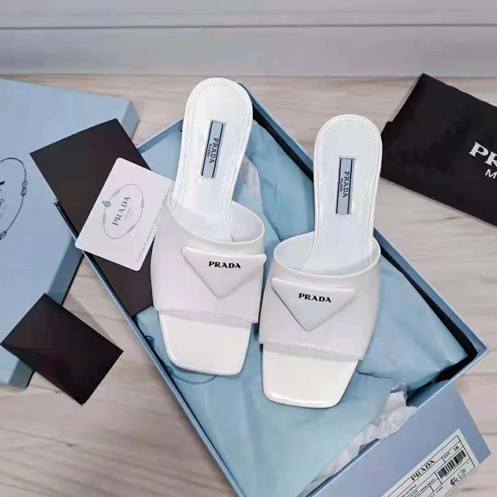 Prada Brushed Leather Mid-heeled Slides in 65mm Heel for Women in White Prada Brushed Leather Mid-heeled Slides in 65mm Heel for Women in White