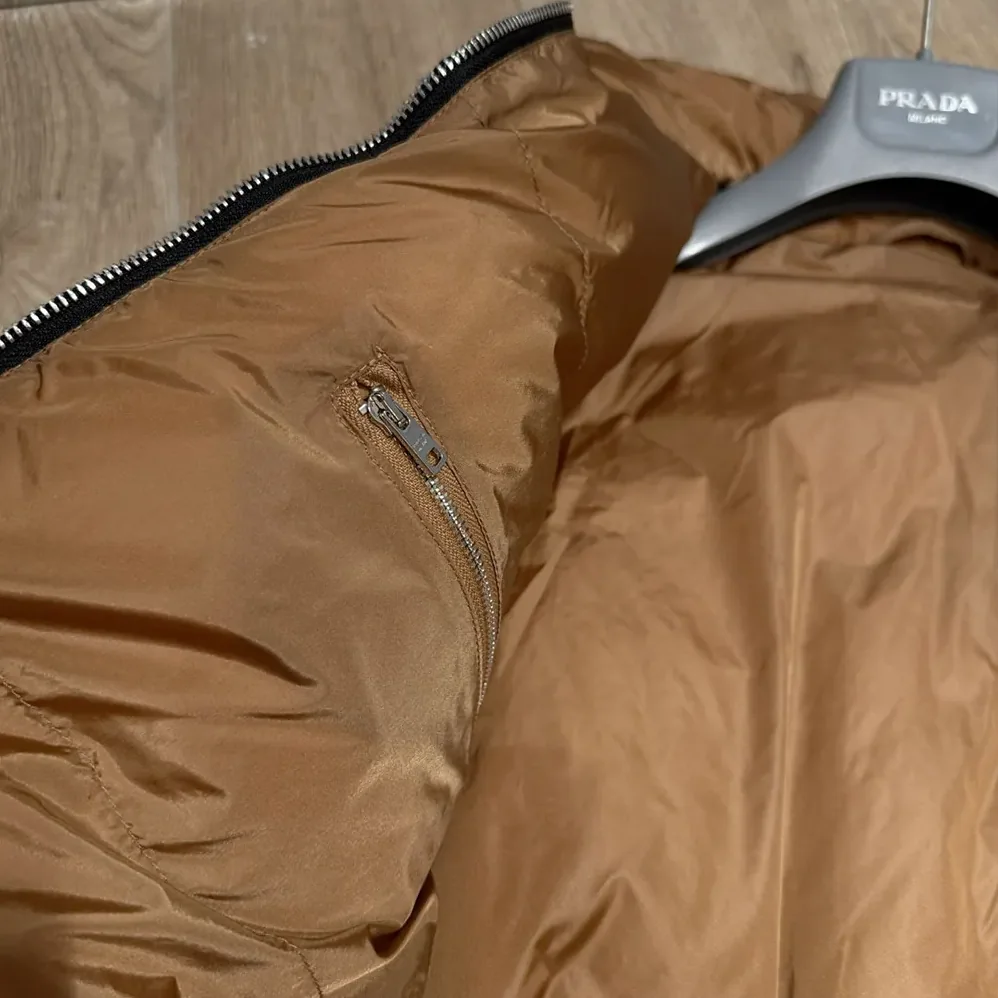 Prada Re-Nylon Down Jacket for Women in Black Prada Re-Nylon Down Jacket for Women in Black