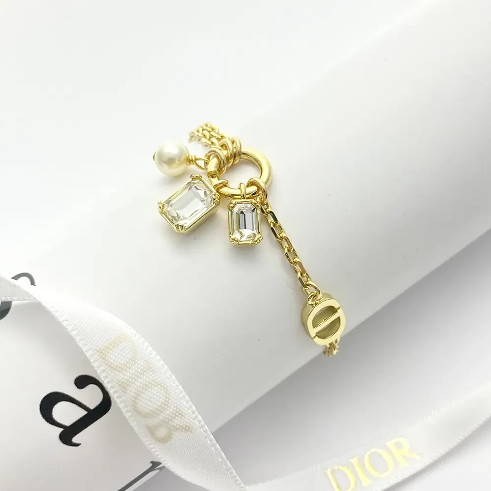 Dior Petit CD Bracelet Gold-Finish Metal with a White Resin Pearl and Silver for Women in Tone Crystals Dior Petit CD Bracelet Gold-Finish Metal with a White Resin Pearl and Silver for Women in Tone Crystals