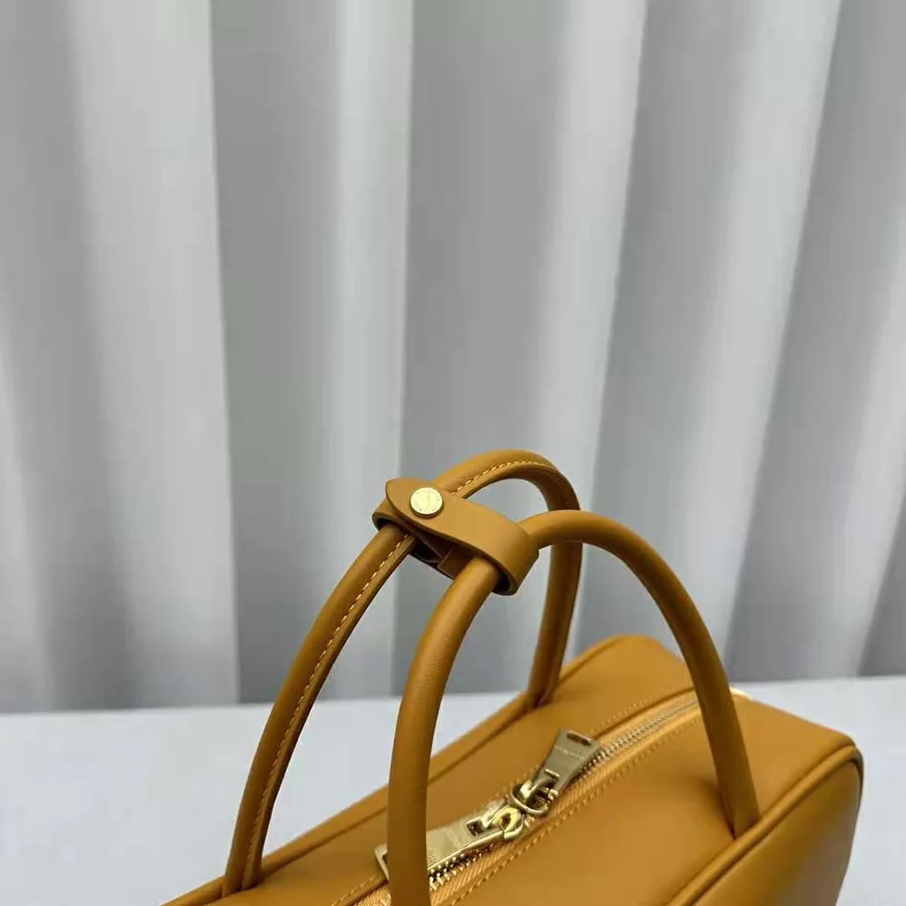 Miu Miu Leather Top-handle Bag with Embossed Lettering Logo for Women in Orange Miu Miu Leather Top-handle Bag with Embossed Lettering Logo for Women in Orange