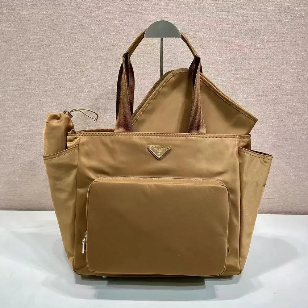 Prada Re-Nylon Baby Bag with Triangle Logo for Unisex in Brown Prada Re-Nylon Baby Bag with Triangle Logo for Unisex in Brown