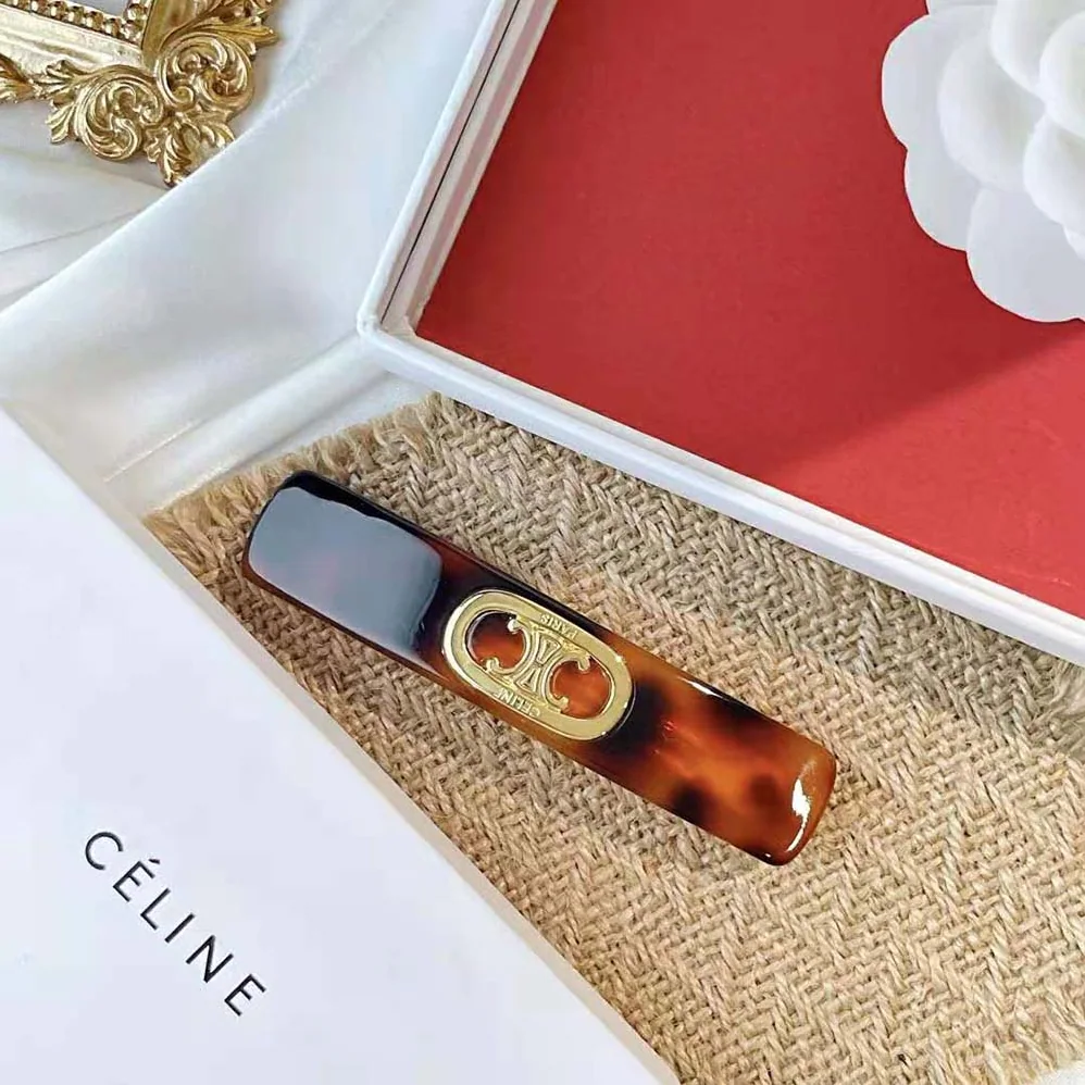 Celine Maillon Triomphe Hair Clip in Gold Brass Acetate and Steel for Women