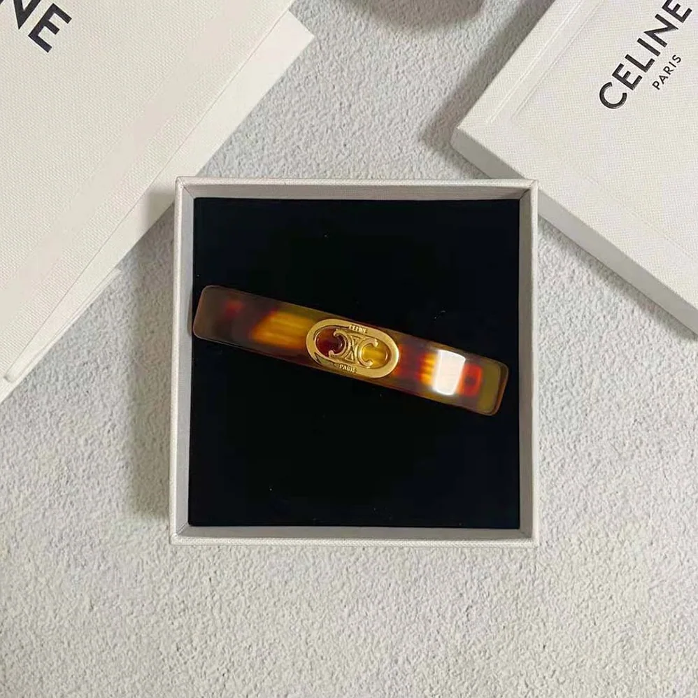 Celine Maillon Triomphe Hair Clip in Gold Brass Acetate and Steel for Women