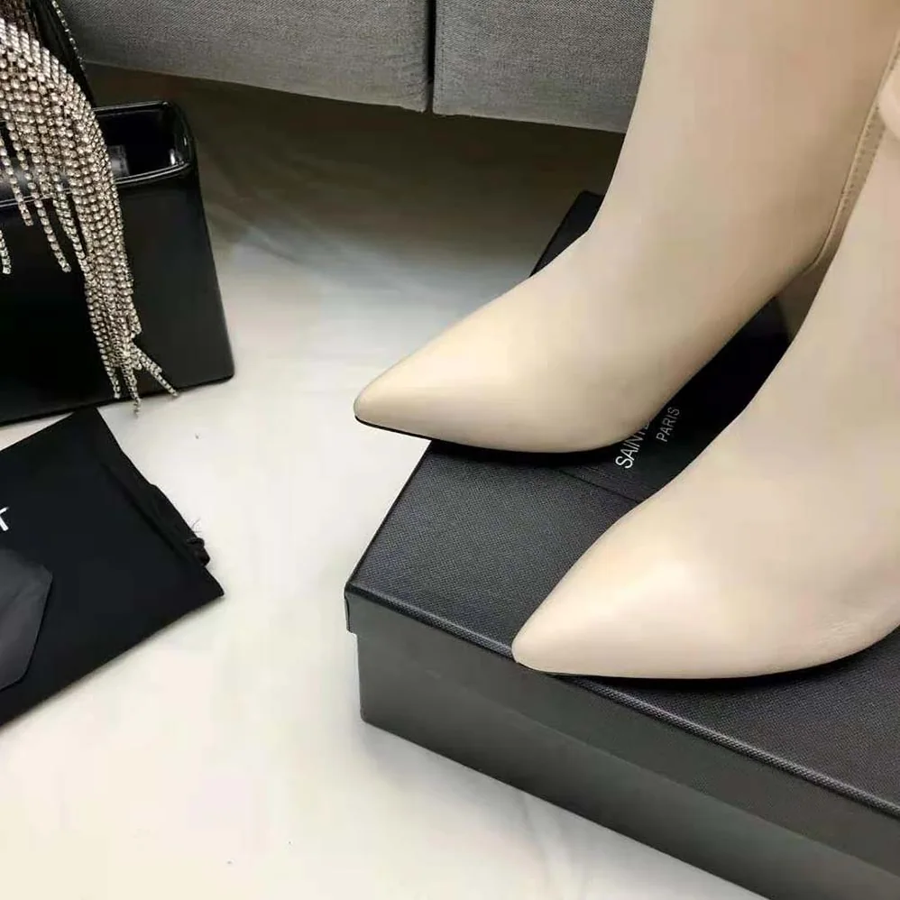 Saint Laurent YSL Niki Booties in Smooth Leather and Silver-Tone Monogram for Women in White Saint Laurent YSL Niki Booties in Smooth Leather and Silver-Tone Monogram for Women in White