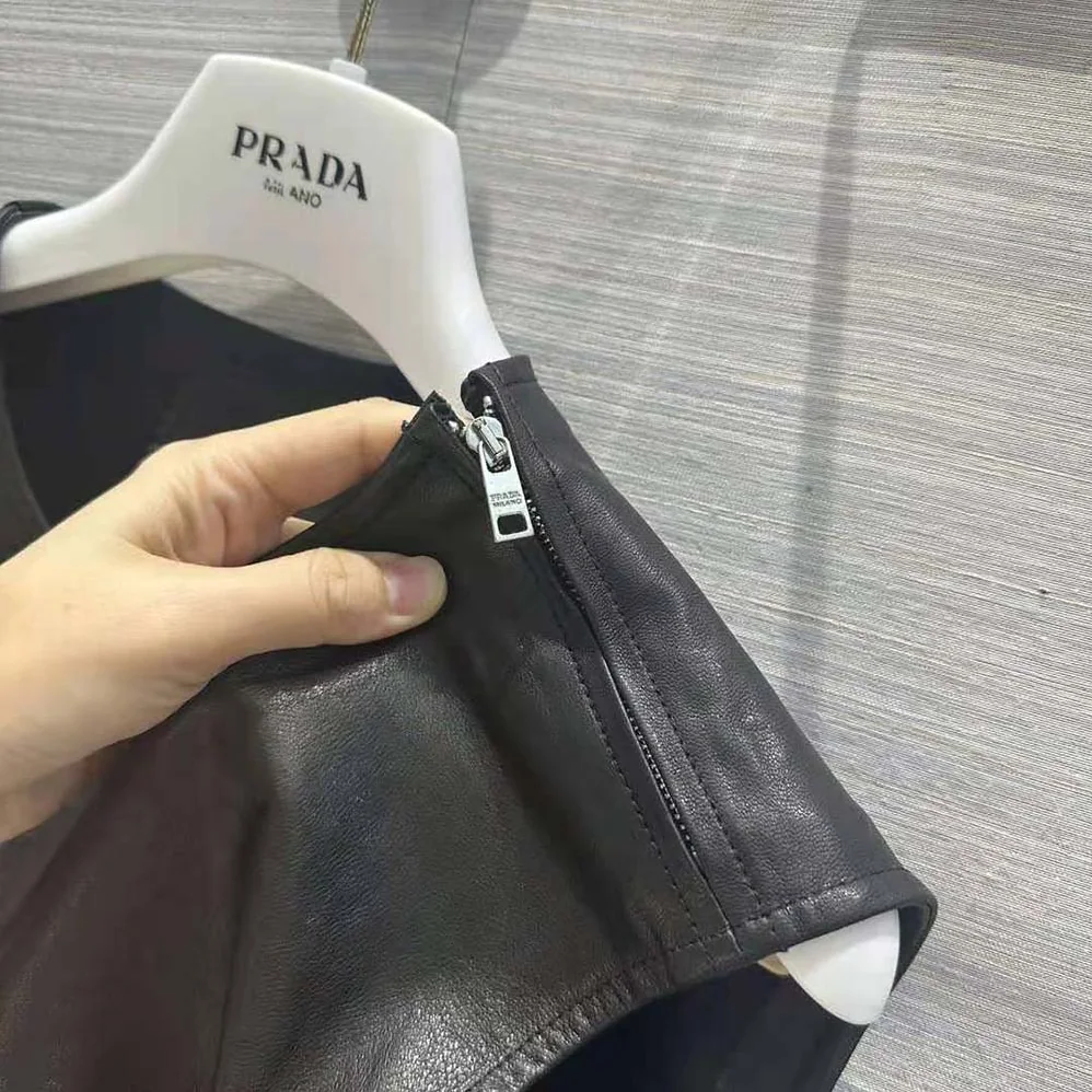 Prada Leather Dress with Knit Triangle Logo for Women in Black Prada Leather Dress with Knit Triangle Logo for Women in Black