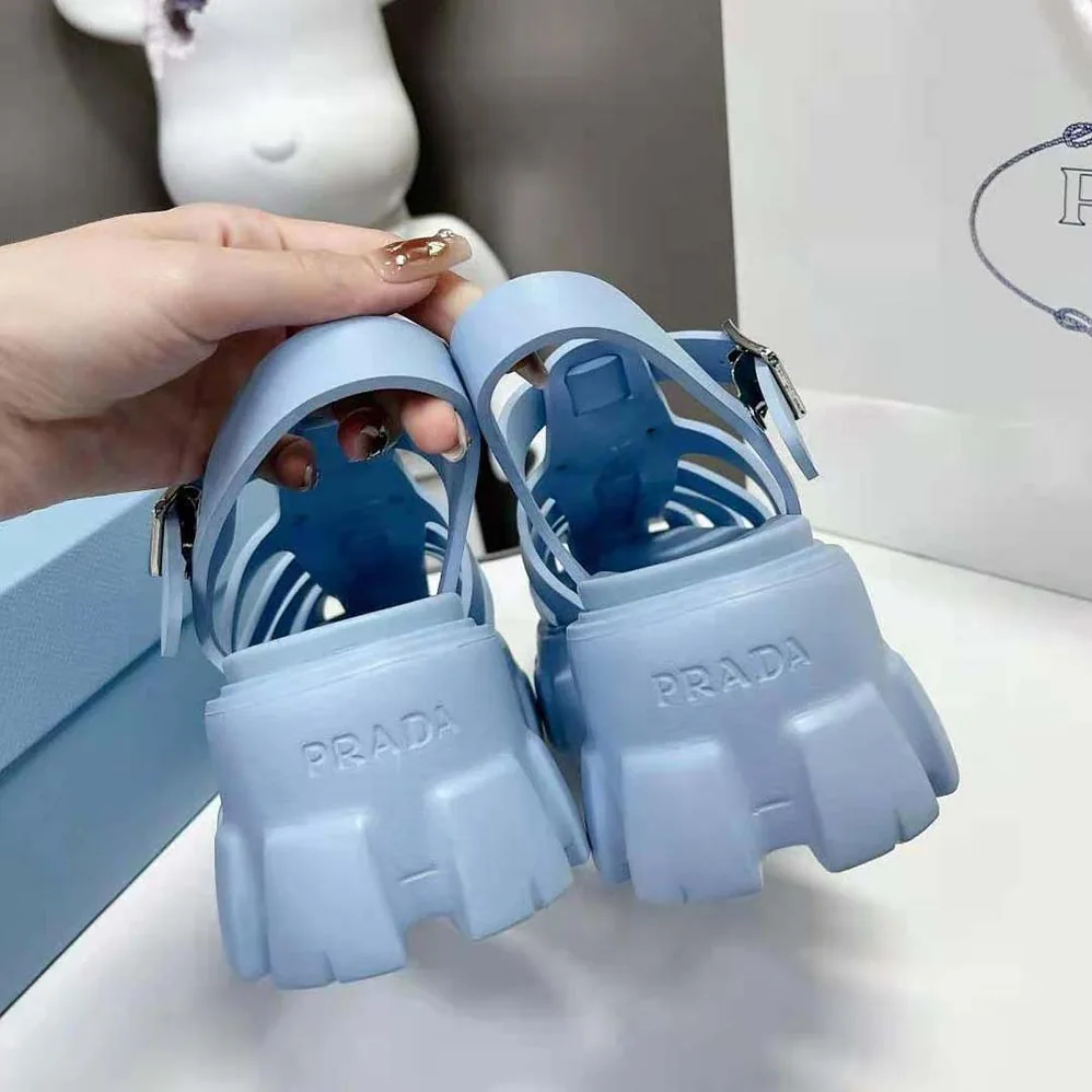 Prada Foam Rubber Sandals with Enameled Metal Triangle Logo for Women in Blue Prada Foam Rubber Sandals with Enameled Metal Triangle Logo for Women in Blue