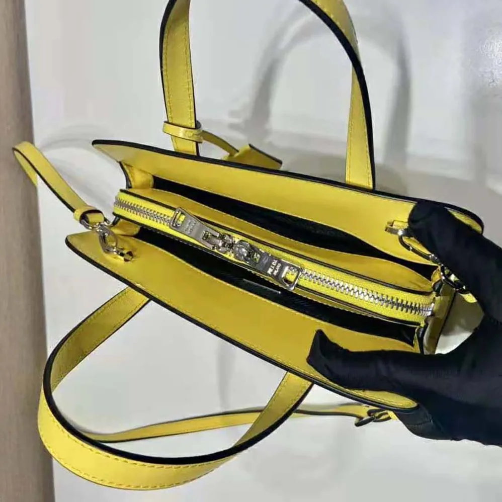 Prada Re-Edition 1995 Brushed-Leather Mini Handbag for Women in Yellow Prada Re-Edition 1995 Brushed-Leather Mini Handbag for Women in Yellow