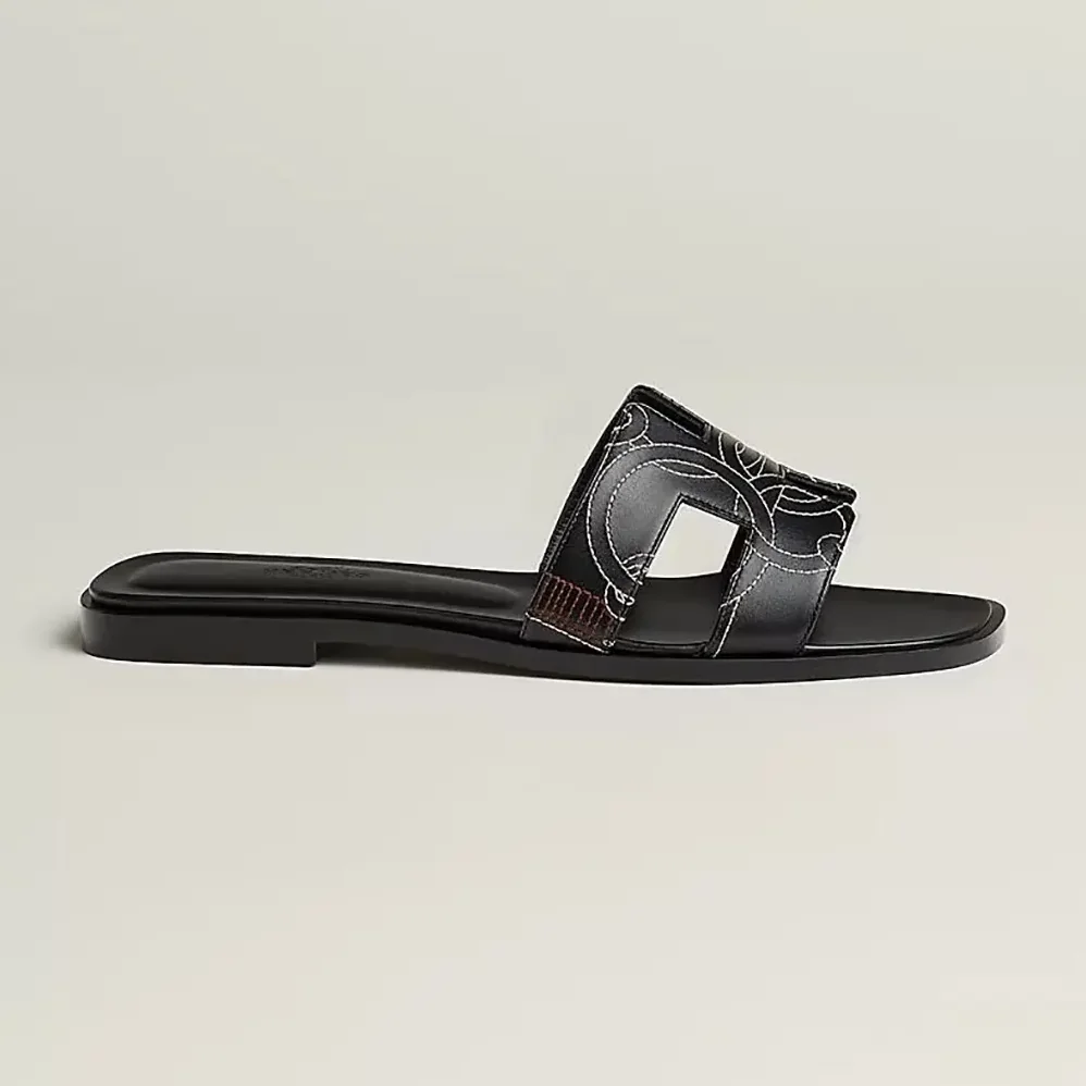 Hermes Oran sandal in “Panoplie Equestre” Embroidered Calfskin for Women in Black Hermes Oran sandal in “Panoplie Equestre” Embroidered Calfskin for Women in Black