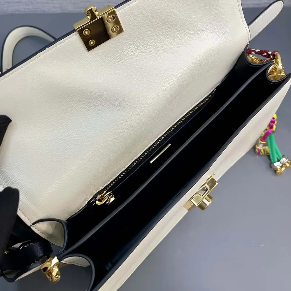 Prada Soft Sound Small Leather Shoulder Bag with Charms for Women in White Prada Soft Sound Small Leather Shoulder Bag with Charms for Women in White