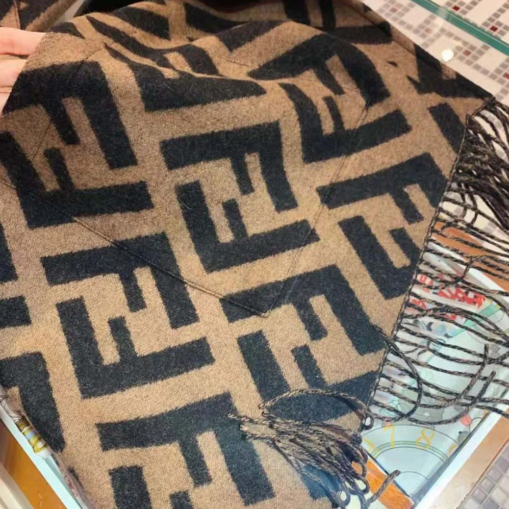 Fendi Brown Cashmere Poncho with Hood and Maxi Pockets on the front for Women Fendi Brown Cashmere Poncho with Hood and Maxi Pockets on the front for Women