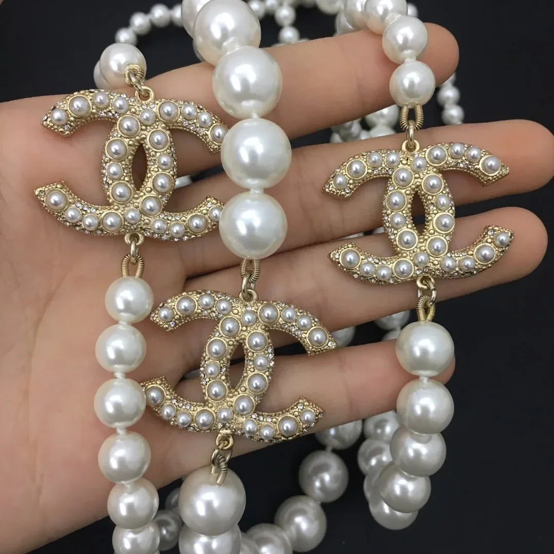 Chanel Three Chanel Iconics Pearl Necklace White Chanel Three Chanel Iconics Pearl Necklace White
