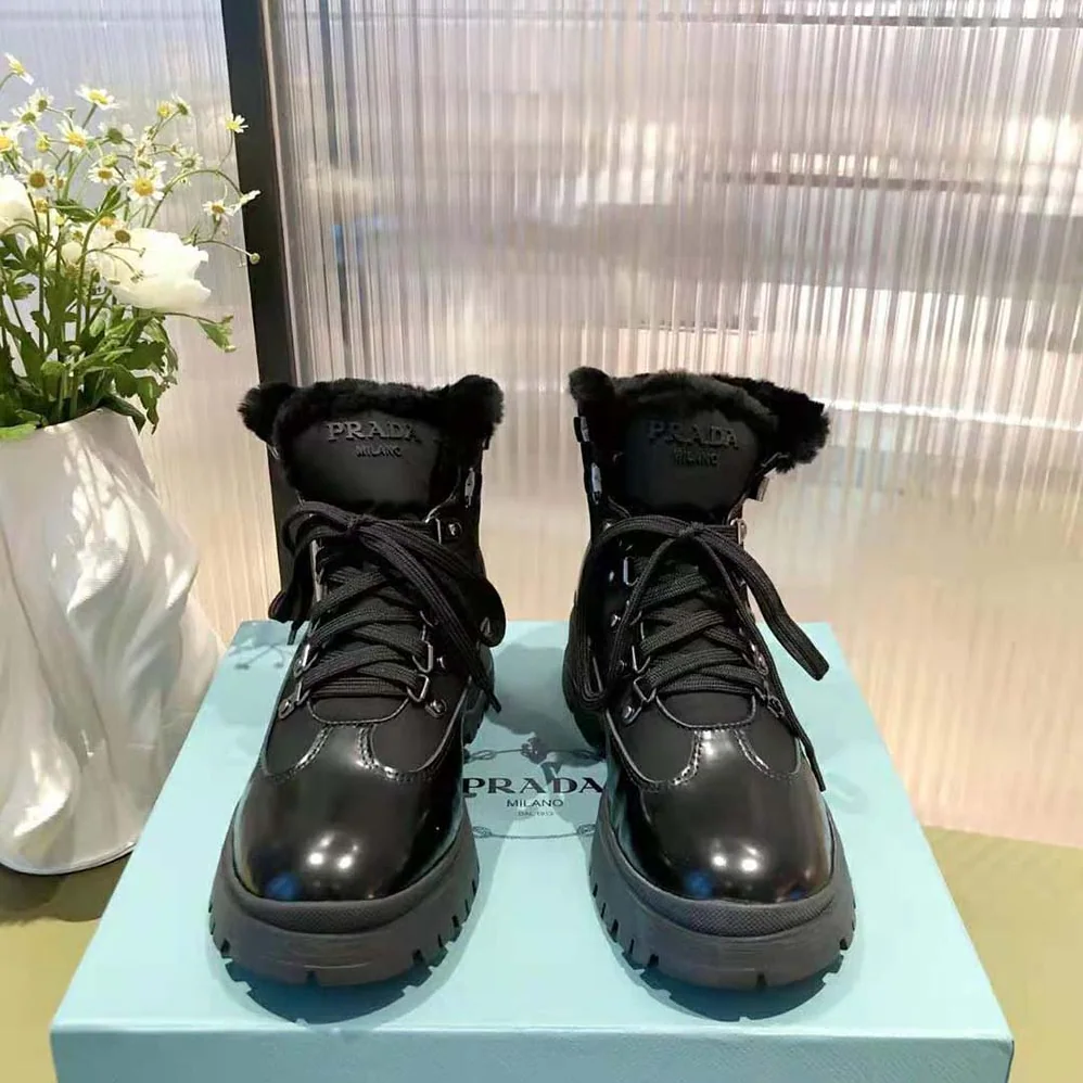 Prada Brixxen Leather and Nylon Booties for Women in Black