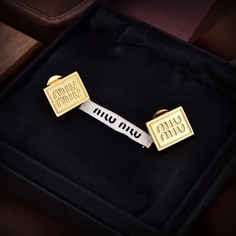 Miu Miu Metal Earrings with Visible Perforated Logo for Women Miu Miu Metal Earrings with Visible Perforated Logo for Women