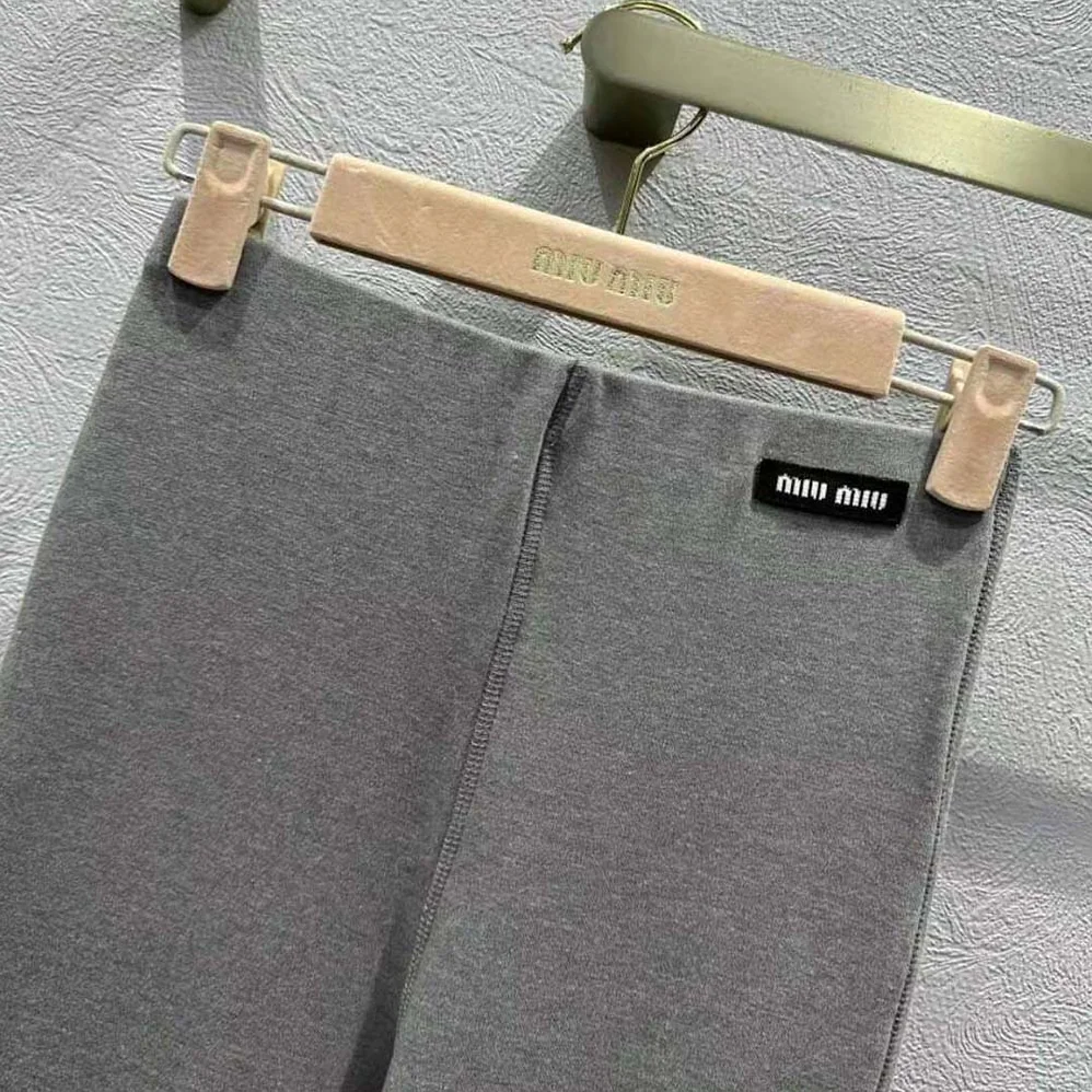 Miu Miu Silk Jersey Pants with Logo Patch for Women in Gray