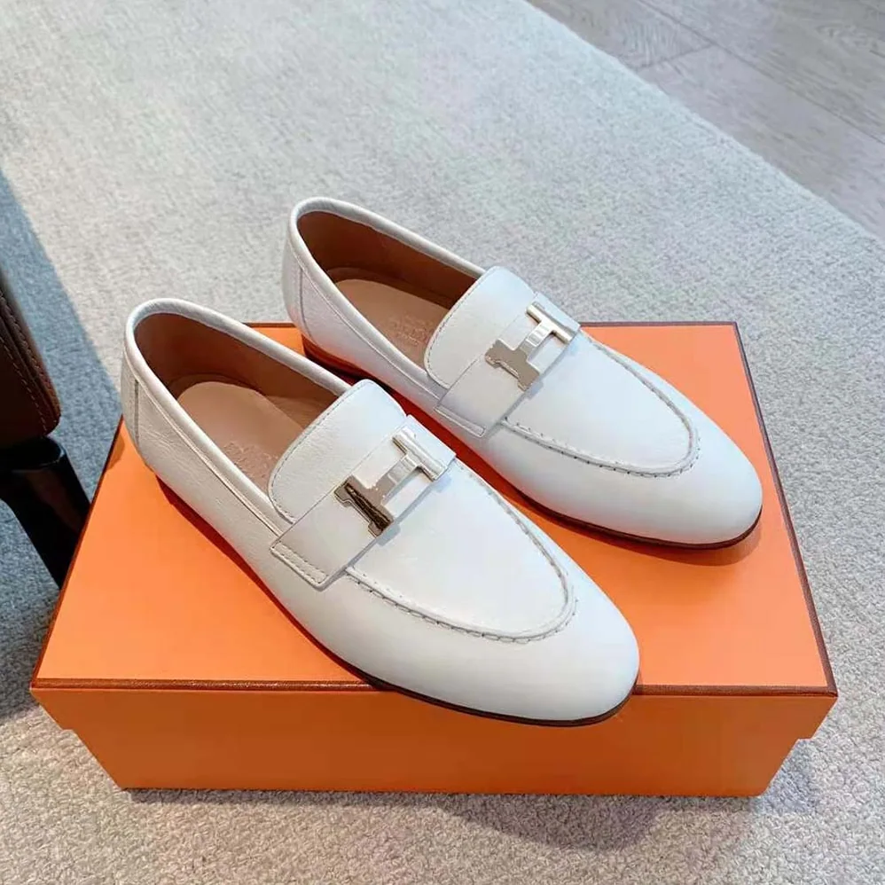 Hermes Paris Loafer in Calfskin with Palladium Plated Signature “H” Detail for Women in White Hermes Paris Loafer in Calfskin with Palladium Plated Signature “H” Detail for Women in White