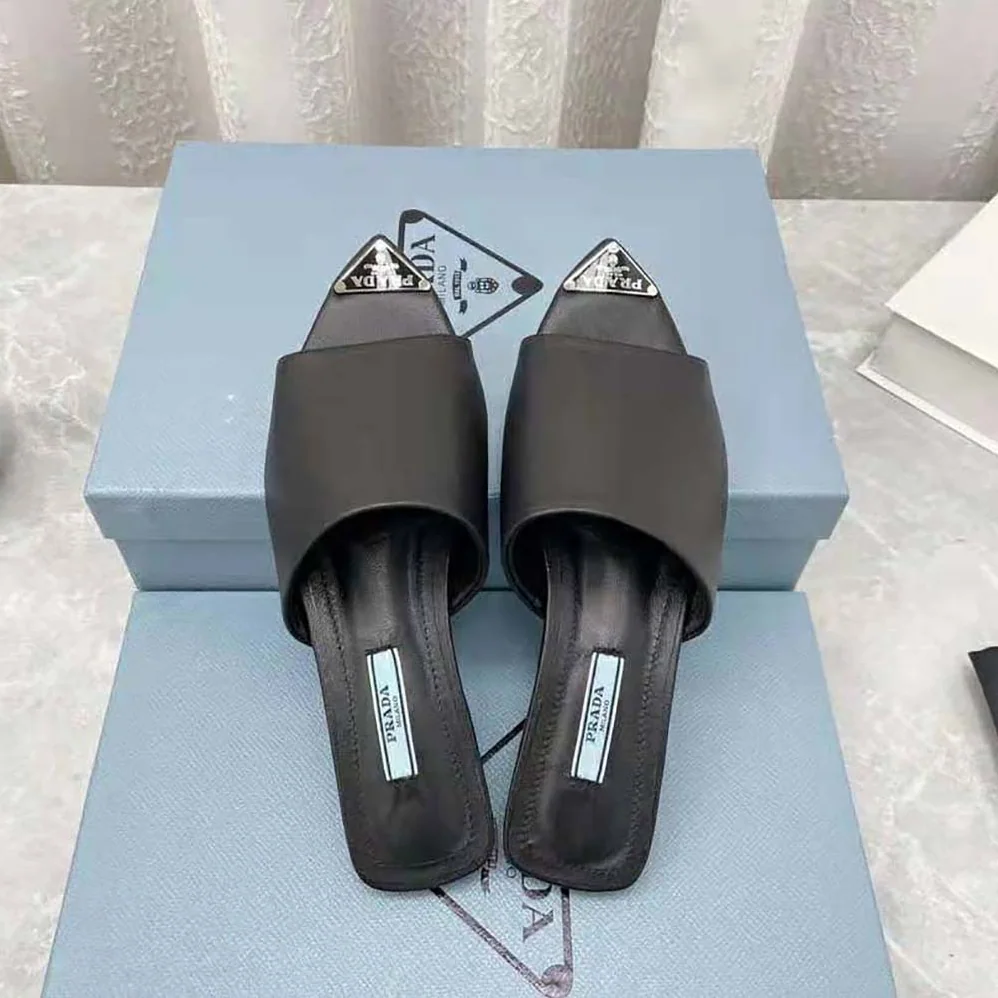 Prada Brushed Leather Slides with a Modernist Line Feature an Unexpected for Women