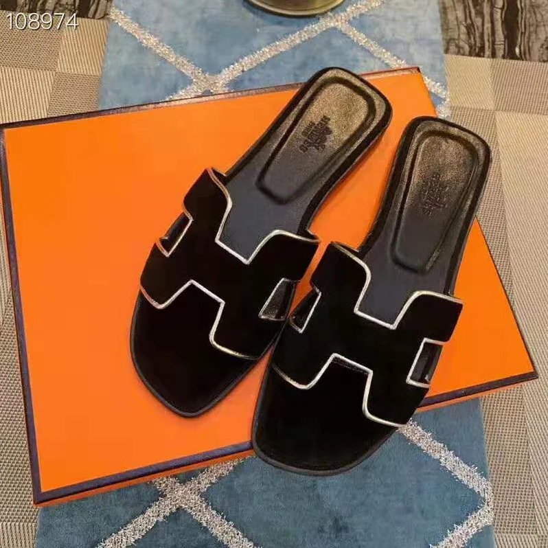 Hermes Oran Sandal in Velvet and Nappa Leather with Metallic Finish and Iconic “H” Cut-Out for Women in Black Hermes Oran Sandal in Velvet and Nappa Leather with Metallic Finish and Iconic “H” Cut-Out for Women in Black