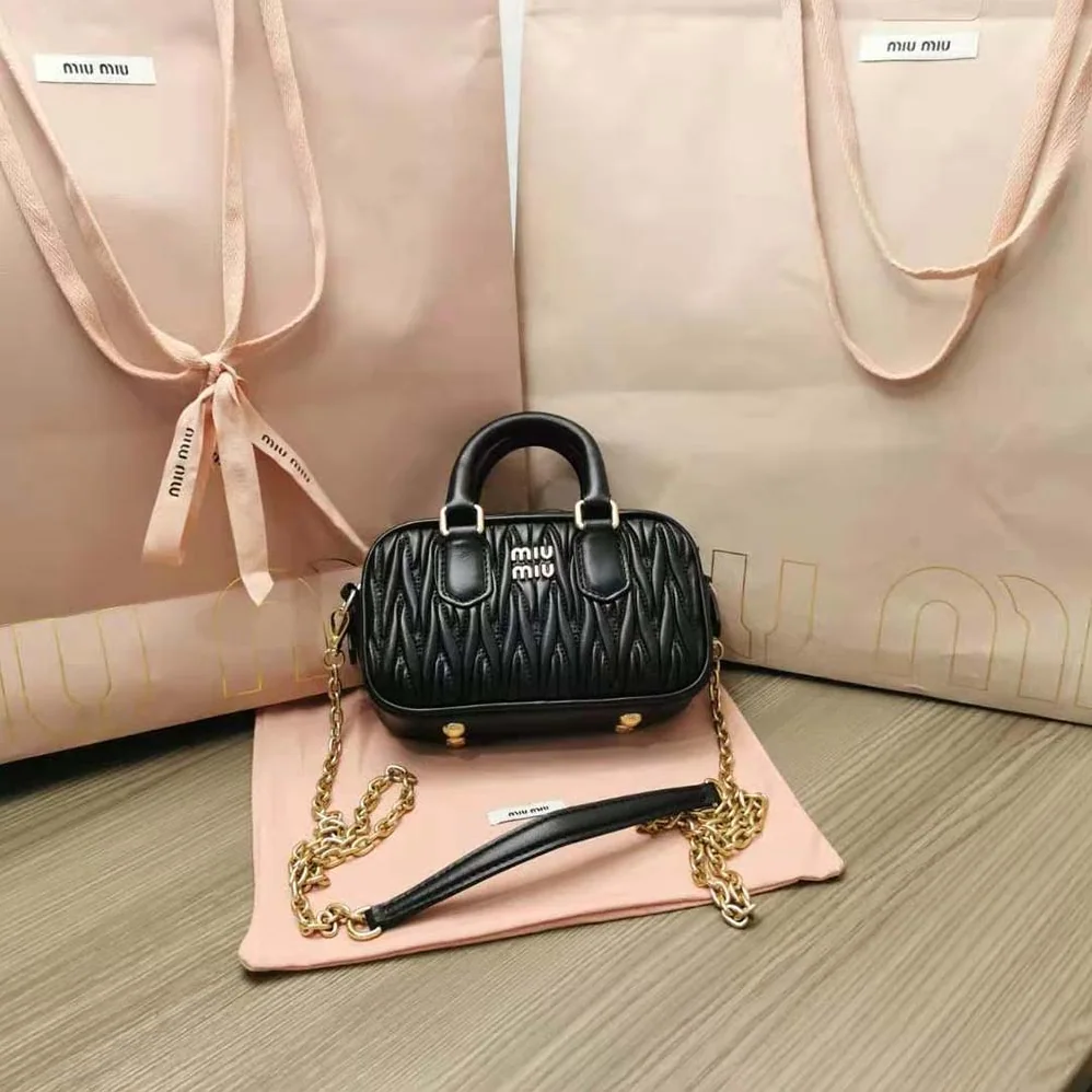 Miu Miu Matelassé Nappa Leather Top-Handle Mini-Bag for Women in Black Miu Miu Matelassé Nappa Leather Top-Handle Mini-Bag for Women in Black