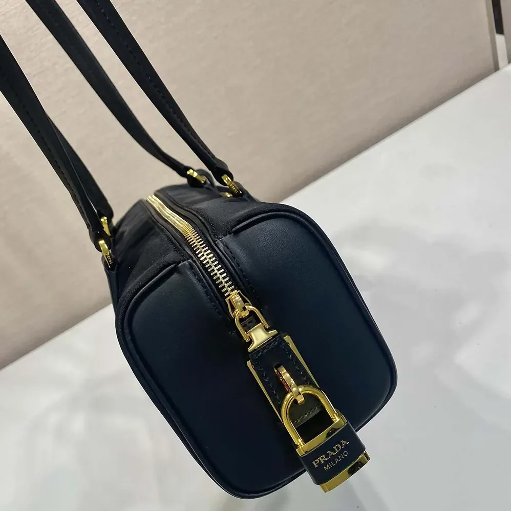 Prada Re-Nylon and Leather Medium Top-handle Bag with Padlock for Women in Black Prada Re-Nylon and Leather Medium Top-handle Bag with Padlock for Women in Black
