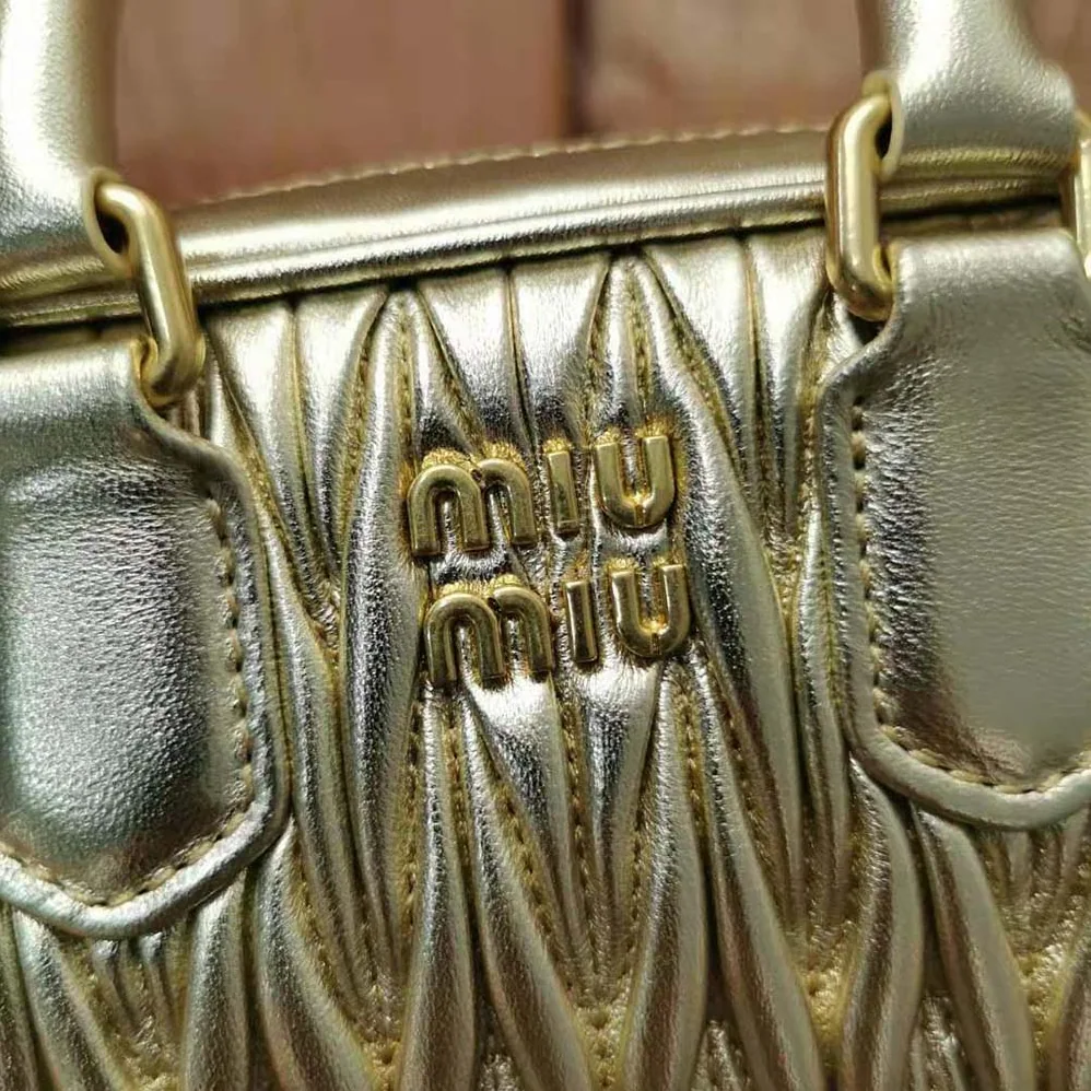 Miu Miu Matelassé Nappa Leather Top-Handle Mini-Bag for Women in Gold