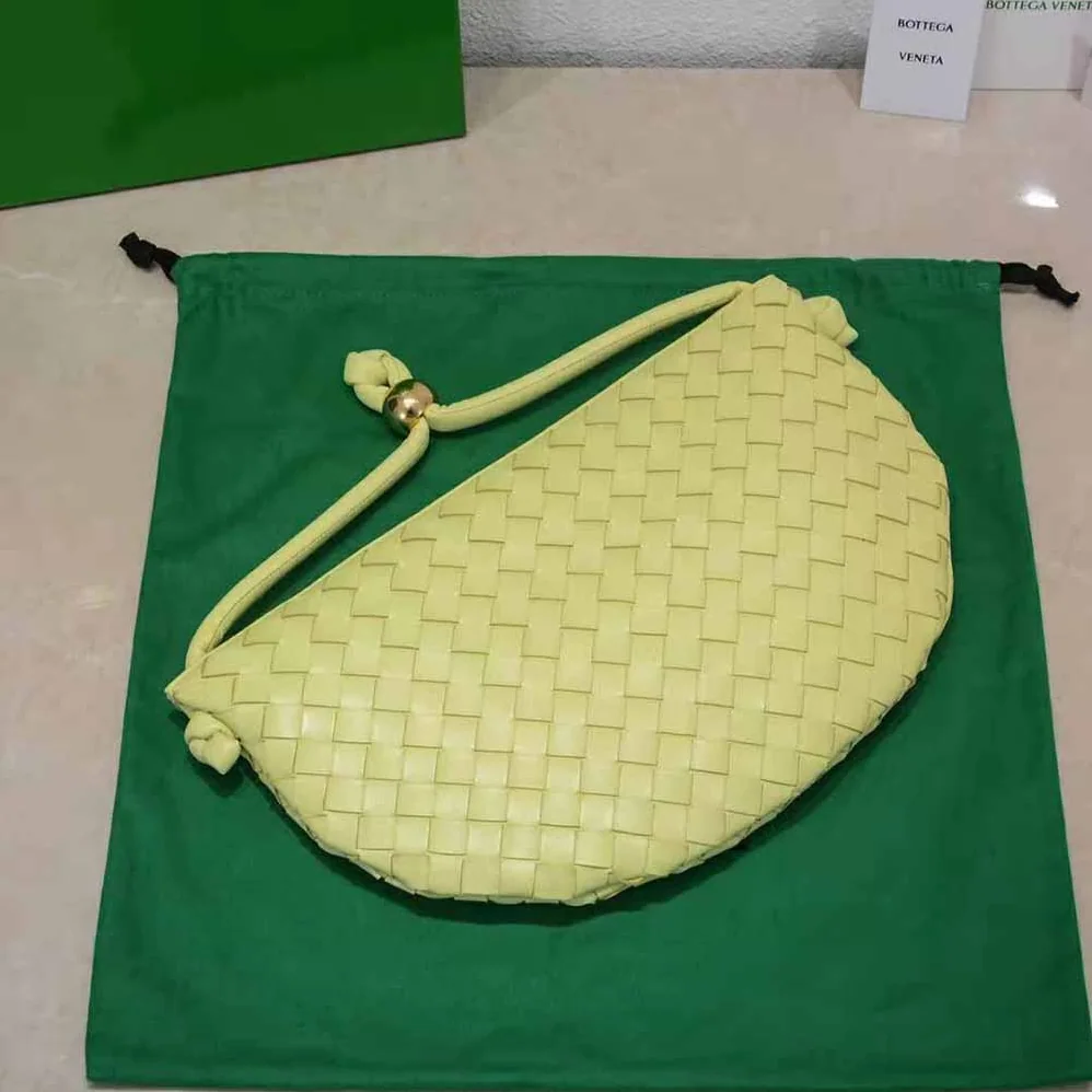 Bottega Veneta Turn Medium Intrecciato Leather Pouch with Adjustable Strap for Women in Yellow Bottega Veneta Turn Medium Intrecciato Leather Pouch with Adjustable Strap for Women in Yellow