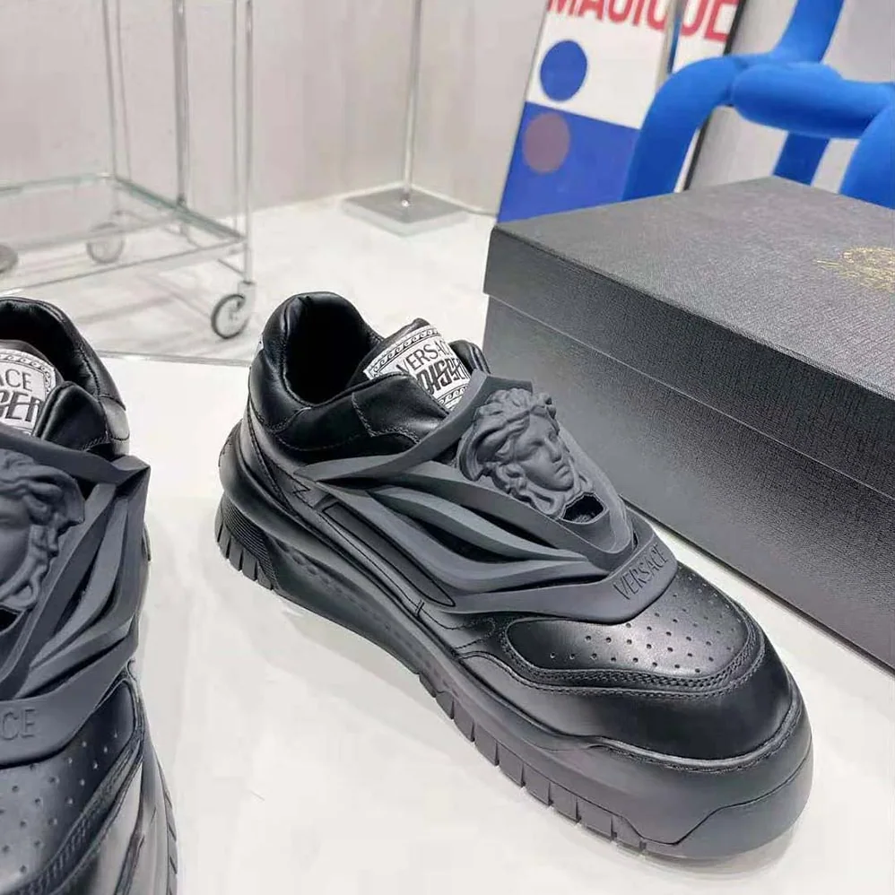 Versace Odissea Sneakers are Set on Rubber Soles with Perforated Toe Caps for Unisex in Black Versace Odissea Sneakers are Set on Rubber Soles with Perforated Toe Caps for Unisex in Black