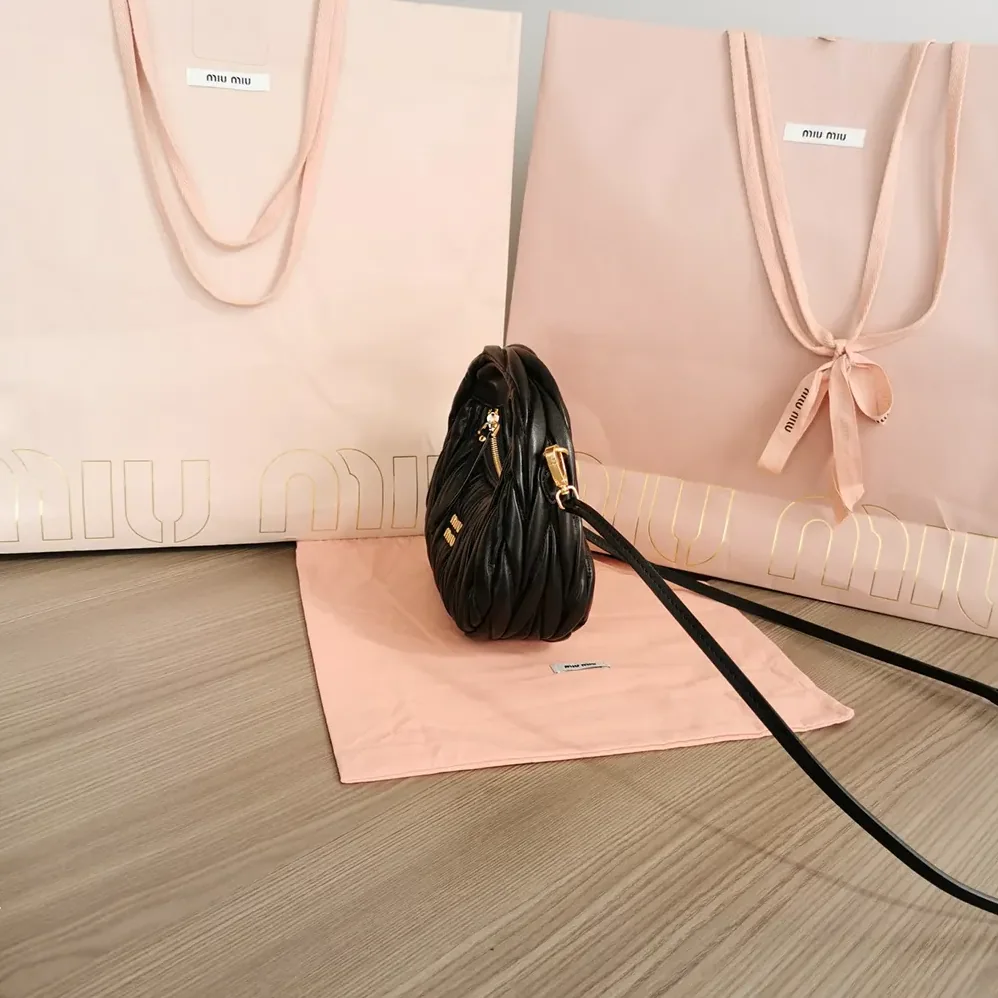 Miu Miu Wander Matelassé Nappa Leather Hobo Mini-Bag for Women in Black Miu Miu Wander Matelassé Nappa Leather Hobo Mini-Bag for Women in Black