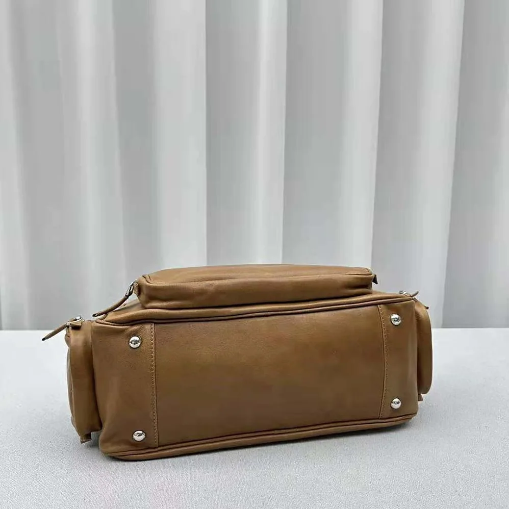 Miu Miu Nappa Leather Top-handle Bag with Embossed Lettering Logo for Women in Brown