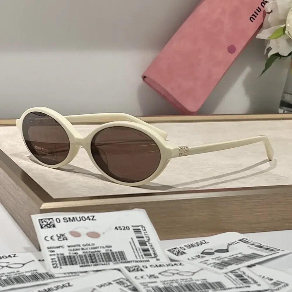 Miu Miu Regard Sunglasses SMU04Z_E1AB_F05S0_C_050 for Women