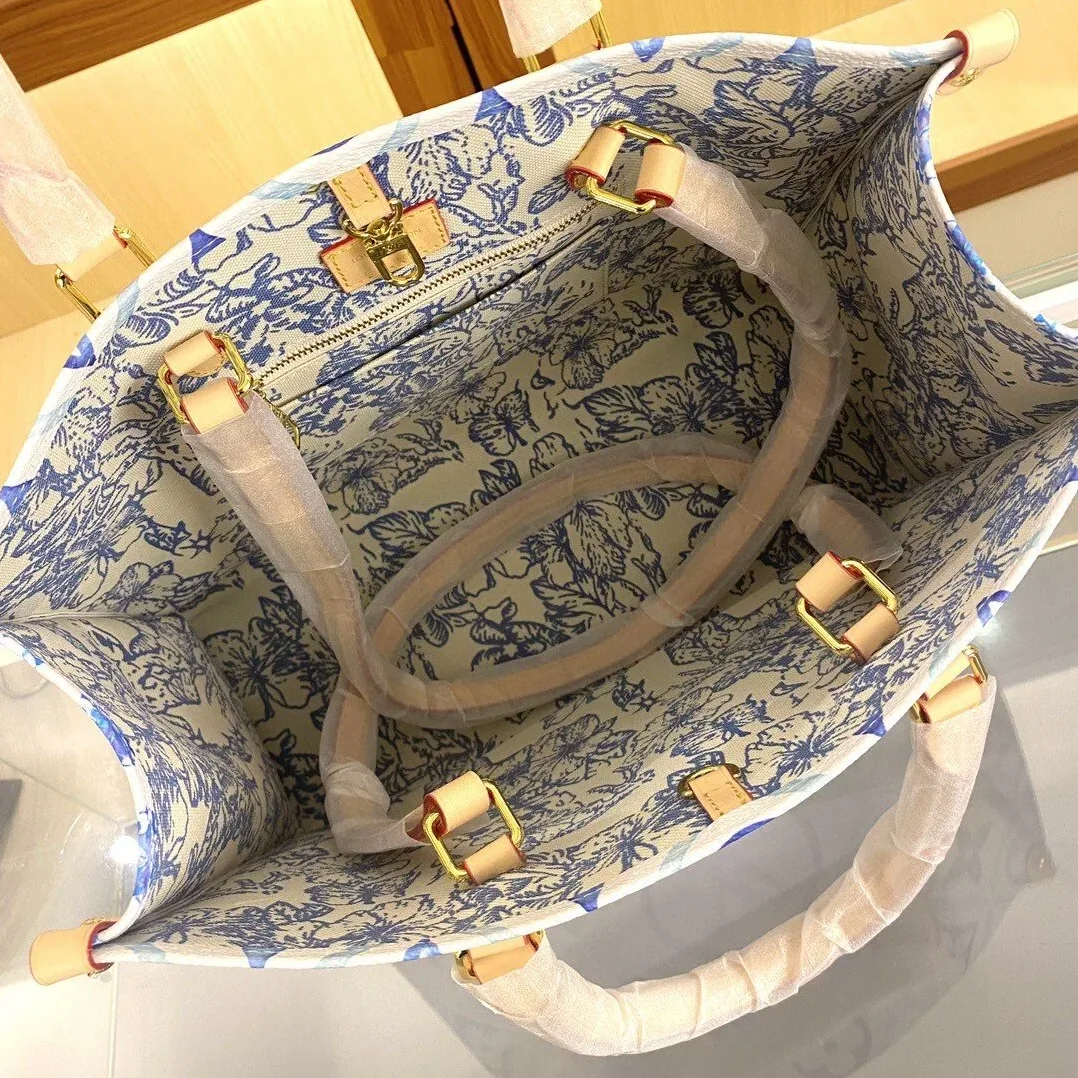 Louis Vuitton OnTheGo MM Tote Bag in Blue Gold Hardware