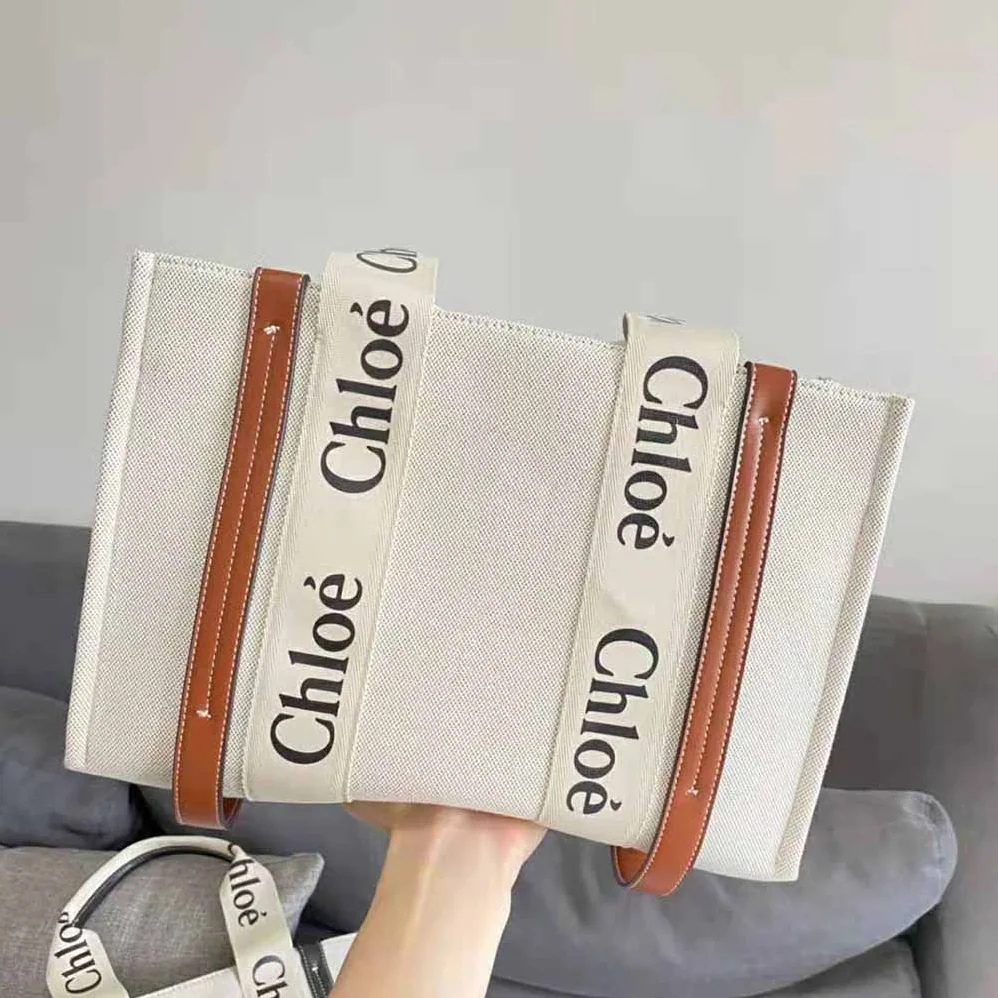Chloe Large Woody Tote Bag in Linen Canvas and Shiny Calfskin with Woody Ribbon for Women Chloe Large Woody Tote Bag in Linen Canvas and Shiny Calfskin with Woody Ribbon for Women
