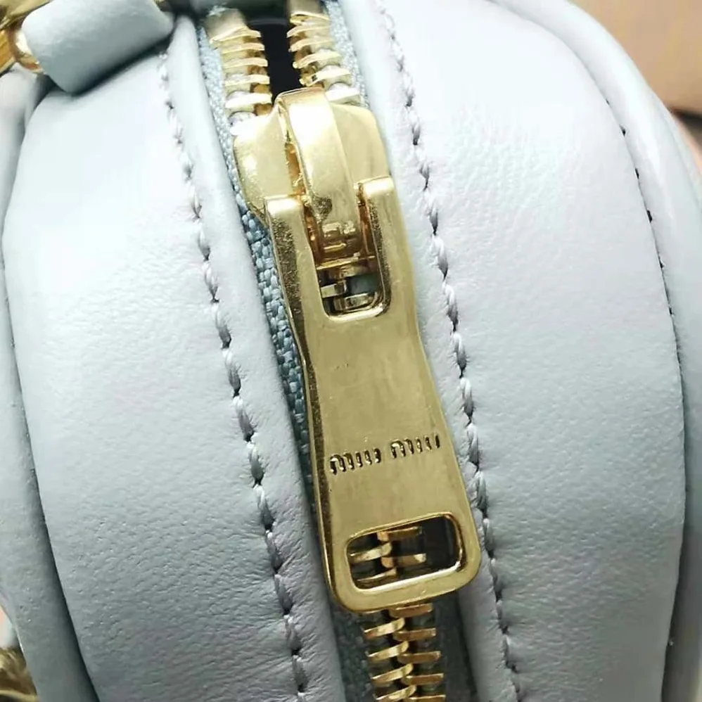 Miu Miu Matelassé Nappa Leather Top-Handle Mini-Bag for Women in Silver