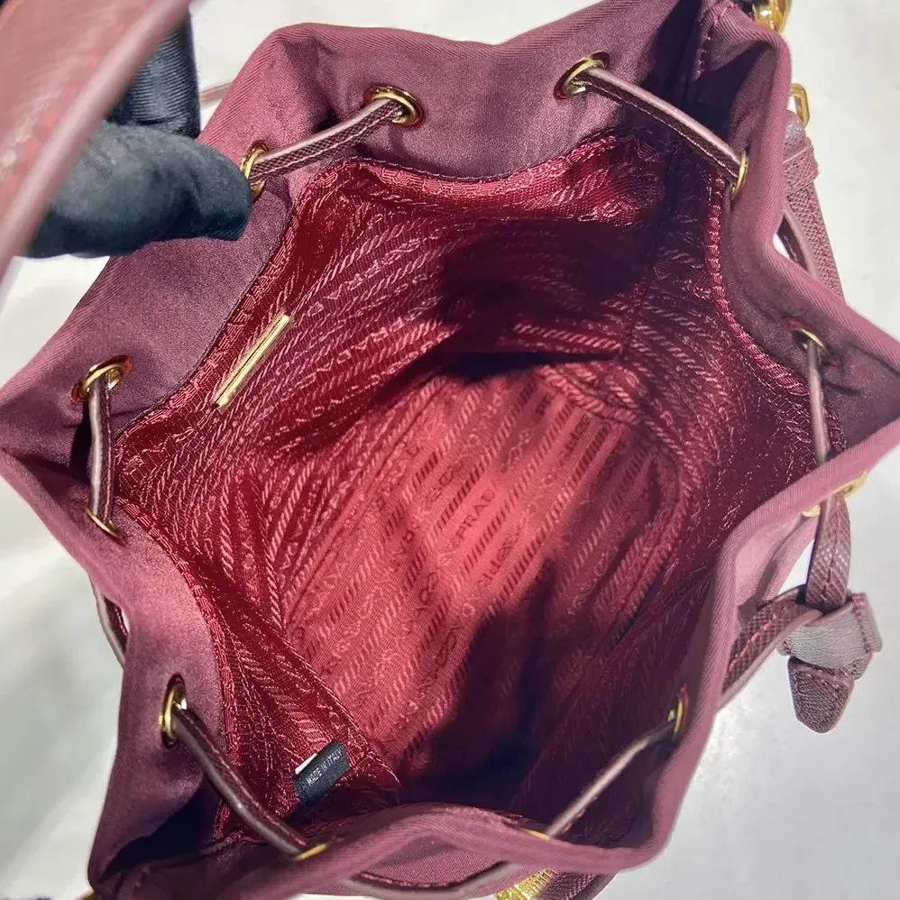Prada Duet Re-Nylon Bucket Bag for Women in Maroon Prada Duet Re-Nylon Bucket Bag for Women in Maroon