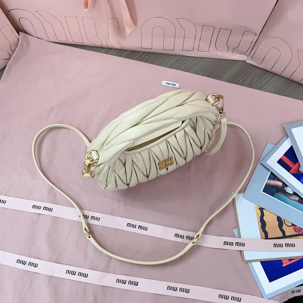 Miu Miu Wander Matelassé Nappa Leather Hobo Mini-Bag for Women in Light Yellow Miu Miu Wander Matelassé Nappa Leather Hobo Mini-Bag for Women in Light Yellow