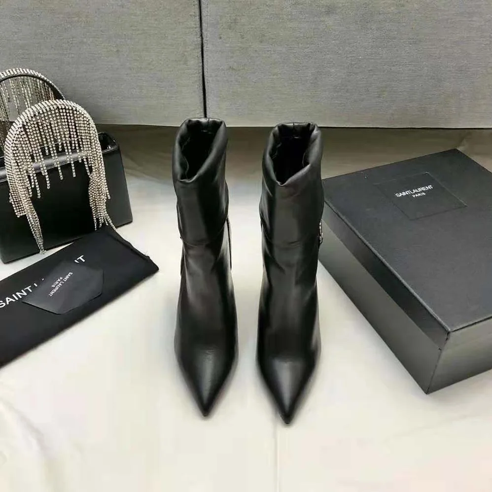 Saint Laurent YSL Niki Booties in Smooth Leather and Silver-Tone Monogram for Women in Black Saint Laurent YSL Niki Booties in Smooth Leather and Silver-Tone Monogram for Women in Black