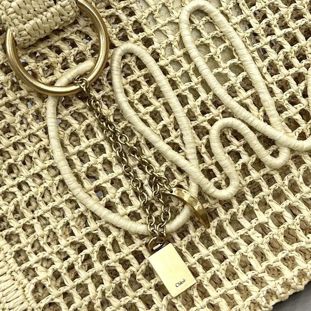 Chloe Summer Banana East-west Tote Bag in Raffia & Buffalo Leather for Women in Beige Chloe Summer Banana East-west Tote Bag in Raffia & Buffalo Leather for Women in Beige