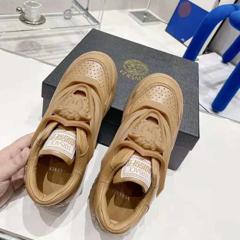 Versace Odissea Sneakers are Set on Rubber Soles with Perforated Toe Caps for Unisex in Brown Versace Odissea Sneakers are Set on Rubber Soles with Perforated Toe Caps for Unisex in Brown