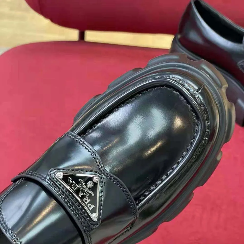 Prada Brushed Leather Monolith Loafers for Unisex in Black