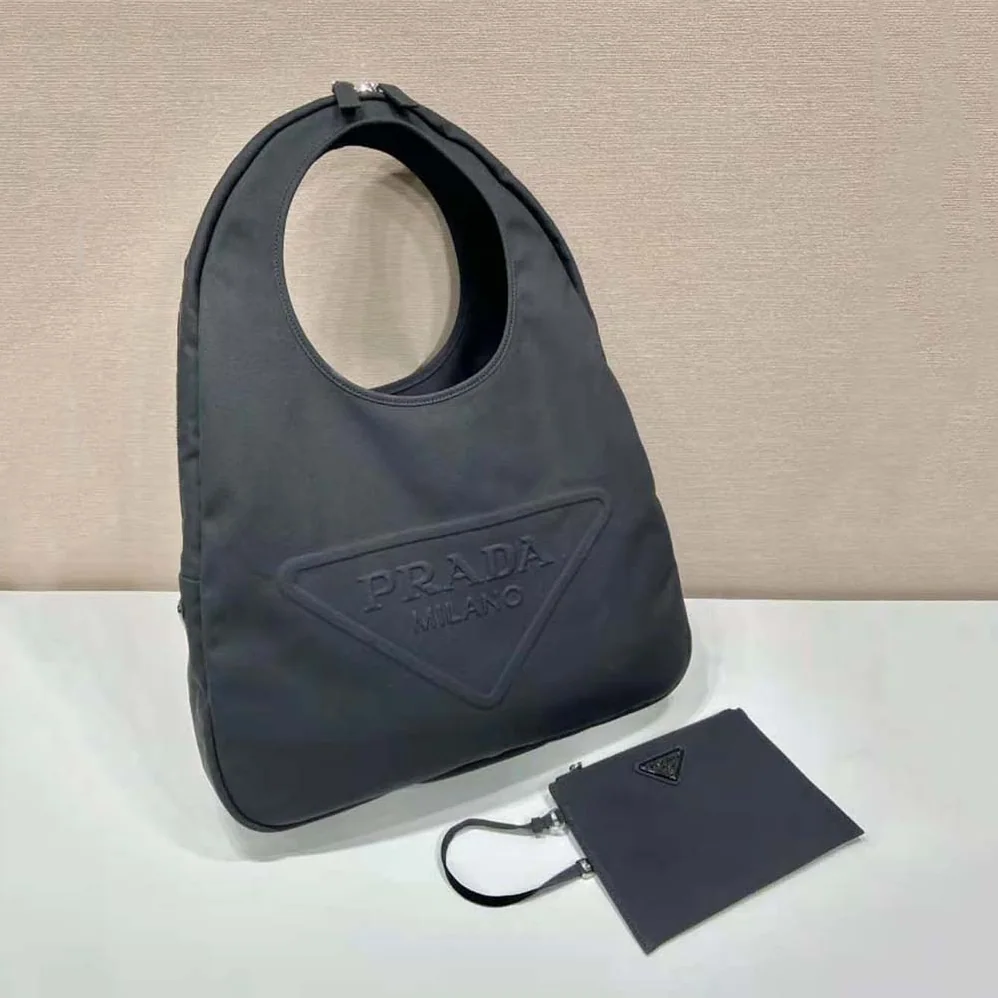 Prada Canvas Hobo Bag with Embossed Logo on the Front for Men in Black Prada Canvas Hobo Bag with Embossed Logo on the Front for Men in Black