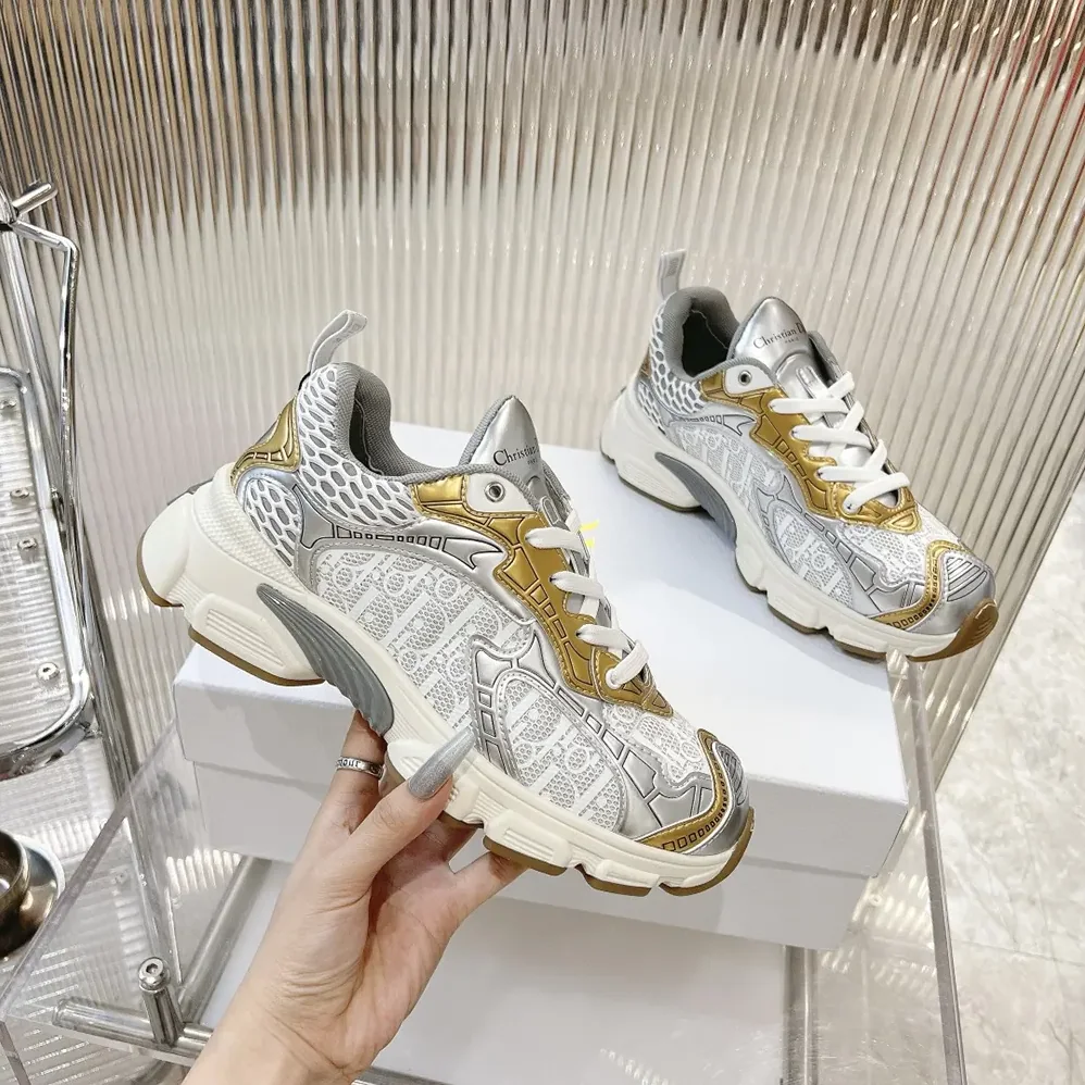 Dior Vibe Sneaker White Mesh Printed with Dior Oblique Motif and Gold- and Silver in Tone Dior Vibe Sneaker White Mesh Printed with Dior Oblique Motif and Gold- and Silver in Tone