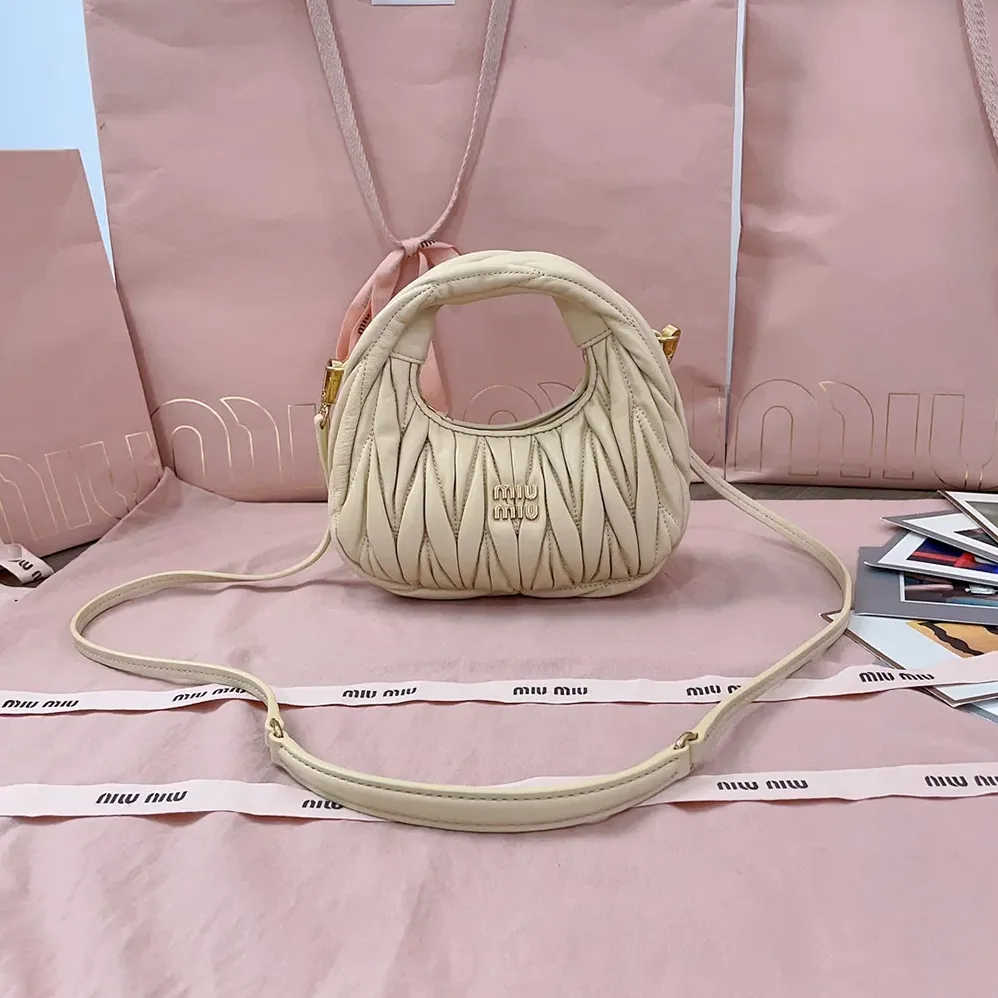 Miu Miu Wander Matelassé Nappa Leather Hobo Mini-Bag for Women in Light Yellow Miu Miu Wander Matelassé Nappa Leather Hobo Mini-Bag for Women in Light Yellow