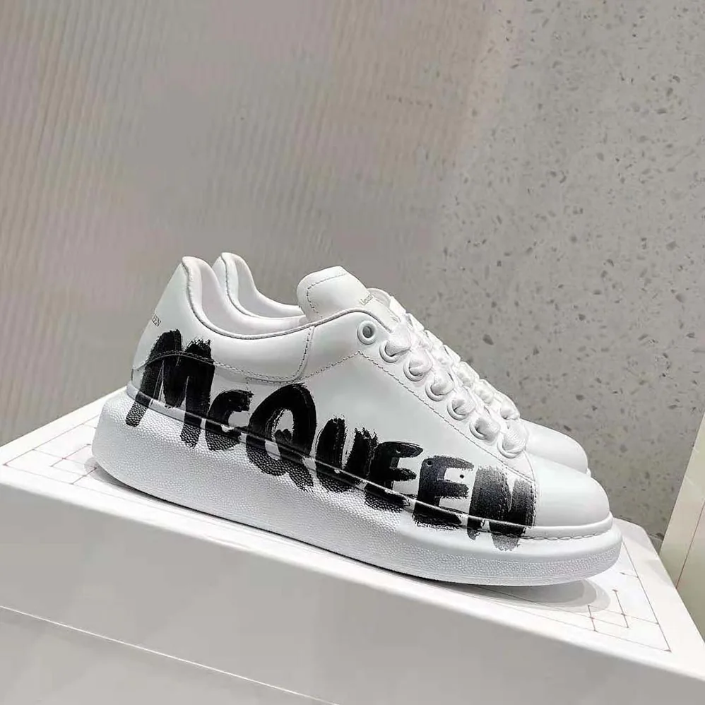 Alexander Mcqueen Online Exclusive Mcqueen Graffiti Oversized Sneaker in White for Unisex in black Alexander Mcqueen Online Exclusive Mcqueen Graffiti Oversized Sneaker in White for Unisex in black
